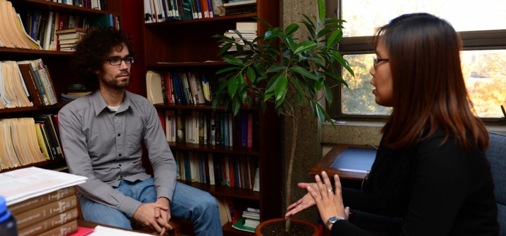 A student and a teacher meet in office hours