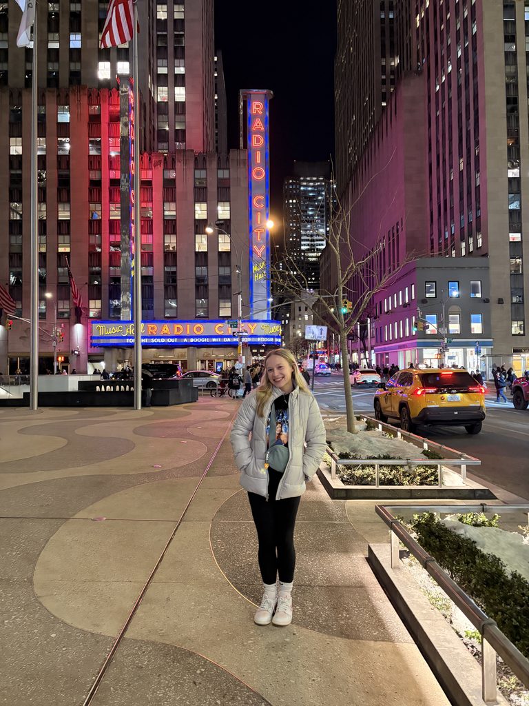 Brianne Eaton stands in front of Radio City Music Hall in Manhattan, New York.