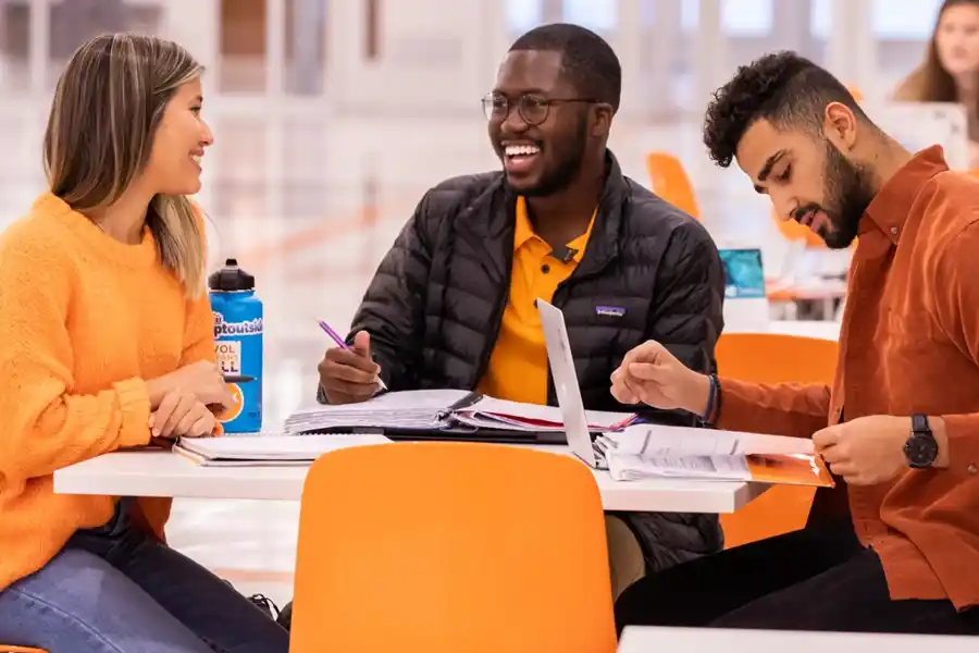 a group of University of Tennessee students work on a group a project