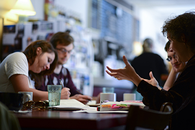 Picture of students interacting with faculty 